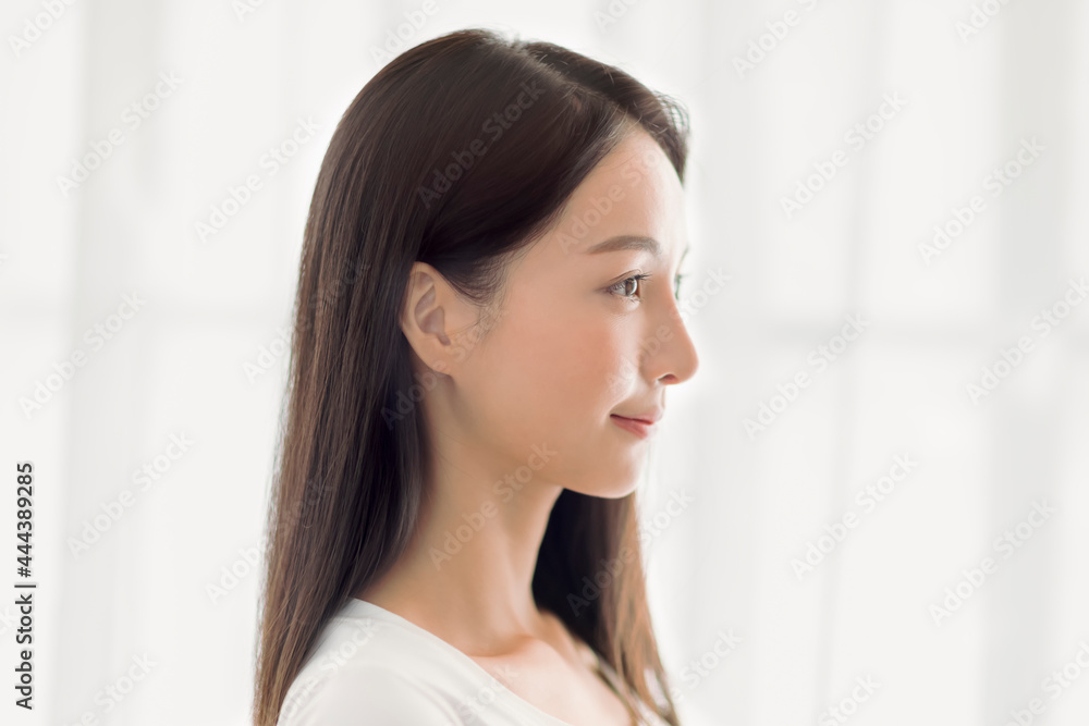 side view of beautiful young asian woman face with clean healthy skin side view of beautiful young asian woman face with clean healthy skin
