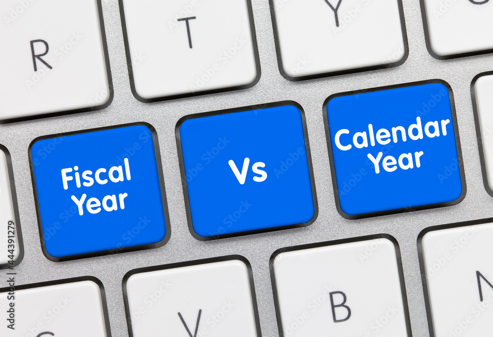 Fiscal Year Vs. Calendar Year - Inscription on Blue Keyboard Key. Fiscal Year Vs. Calendar Year - Inscription on Blue Keyboard Key.