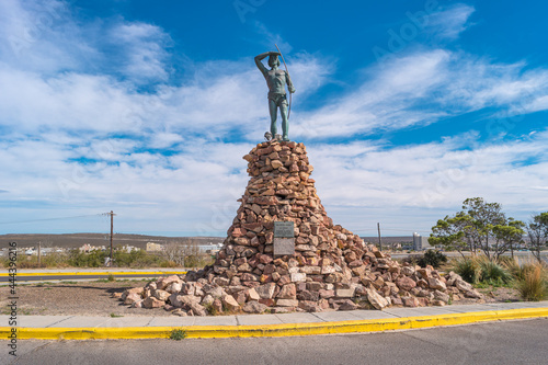 Monument to pre Columbian indigenous people Indio Tehuelche lived in South America before Spanish Britain people discovered it, Puerto Madryn, Chubut, Argentina. photo