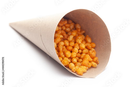 Close up of crunchy masala boondi Indian namkeen (snacks) In handmade ( handcraft ) brown paper cone bag photo