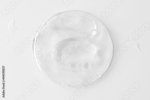 Plastic can with transparent gel or cream for body, as texture or background. Top view.