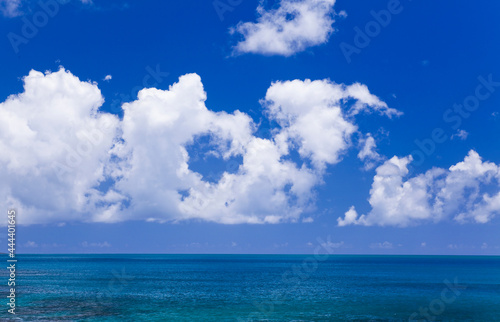  The tropical sea under the blue sky and clouds