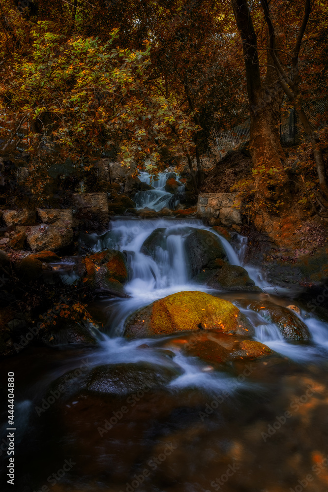 Unnamed waterfall in Ulupinar premium park restaurant. Kemer, Antalya, Turkey. Long exposure. Autumn time