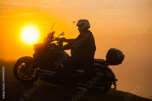 silhouette of a person on a motorcycle © Eugene