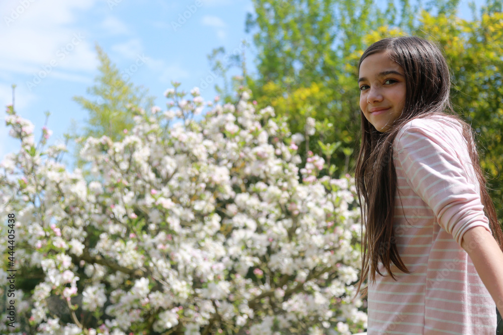 young girl with spring flower tree background young girl with spring flower tree background