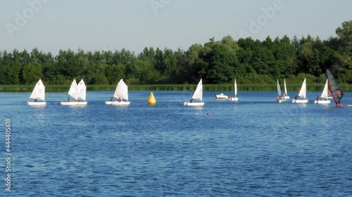 Scenic View Of A Group Of People In Optimist Dinghy In Kolbudy Village In Poland - wide shot photo