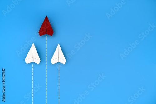 Three paper planes against  blue background