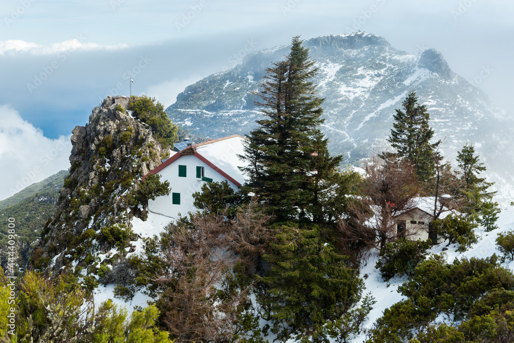 Pico Ruivo house covered with snow in Santana, Madeira island