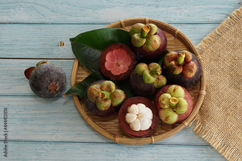 the mangosteen fruit on the wooden board