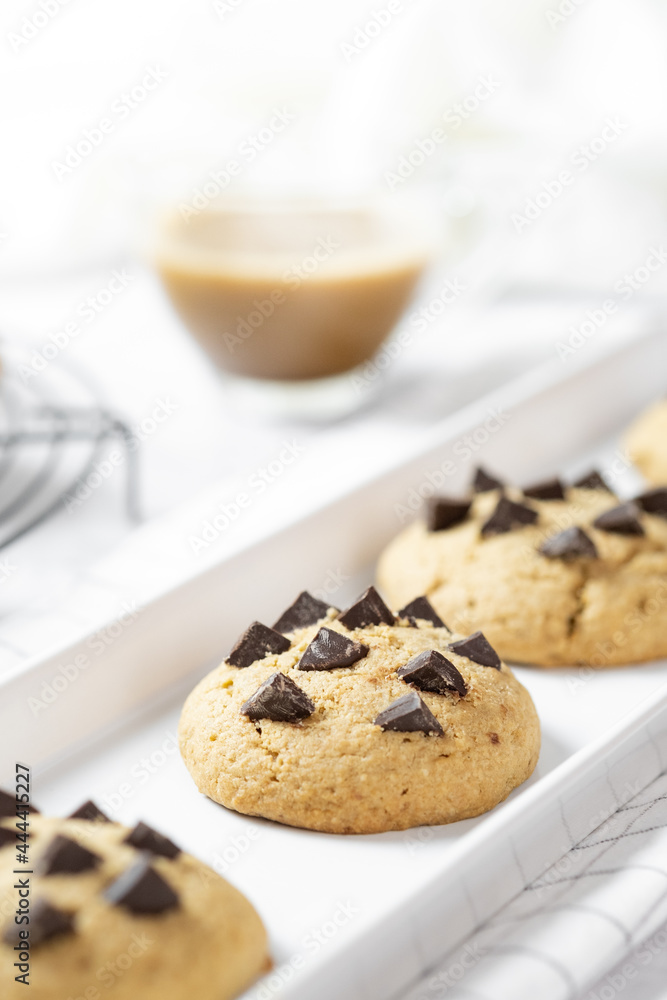 Delicious Whole Wheat Chocolate Chip Cookies set on white cafe table. Delicious Whole Wheat Chocolate Chip Cookies set on white cafe table.