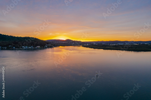 High cloud covered winter sunrise waterscape