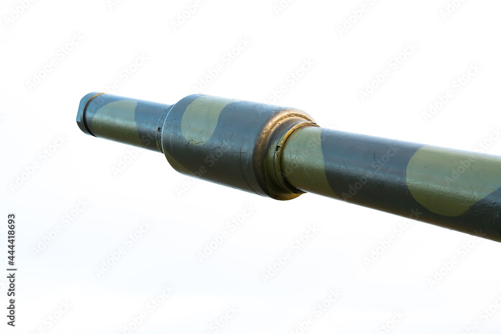 Fototapeta premium Barrel of a high caliber cannon in a defensive position on a hillside. Close up image.