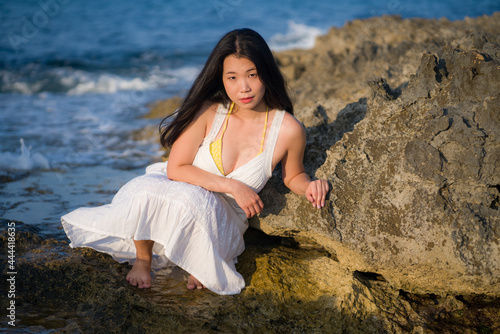 Wallpaper Mural young happy and beautiful Asian woman by the sea - Attractive Korean girl in white dress enjoying relaxed summer holidays at tropical island in travel and lifestyle concept Torontodigital.ca