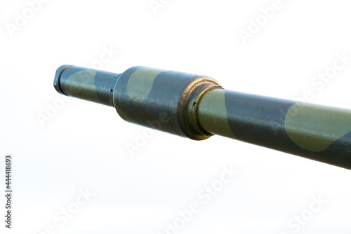 Barrel of a high caliber cannon in a defensive position on a hillside. Close up image.