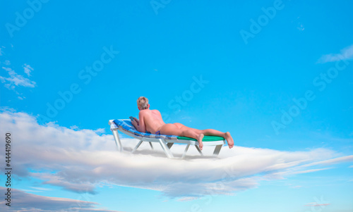 Blur of a blondie woman sunbathing on the clouds