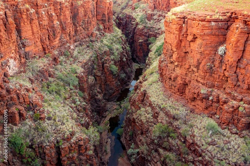 Landscape of Joffre Gorge with red cliffs and Joffre Creek in Western Australia photo