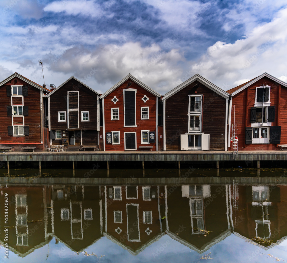 red and brown wooden warehouses along the waterfront in Hudiksvall red and brown wooden warehouses along the waterfront in Hudiksvall