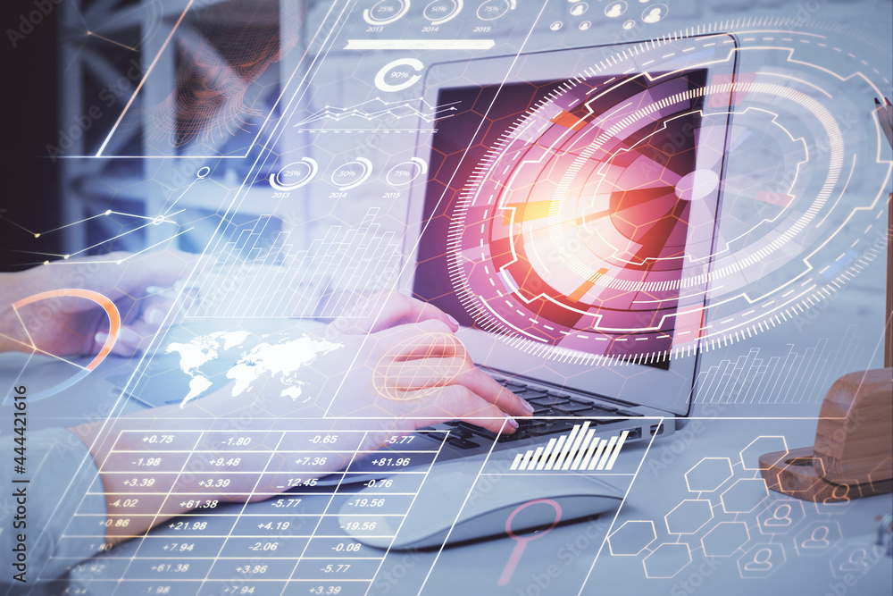 Double exposure of woman hands working on computer and data theme hologram drawing. Tech concept.