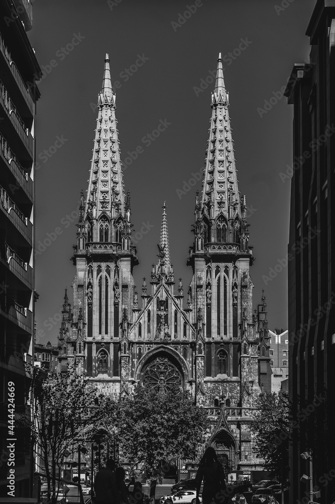 Fototapeta premium Black and white photo of old catholic church. Cathedral in black and white colours in sunny day