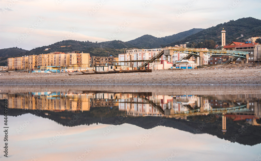 Reflection of a village on a pond of sea water in Algeria overlooking the sea. Jijel, algeria, A small town on the Mediterranean coast of North Africa, 300 km from Algiers, Algeria city. algeria beach
