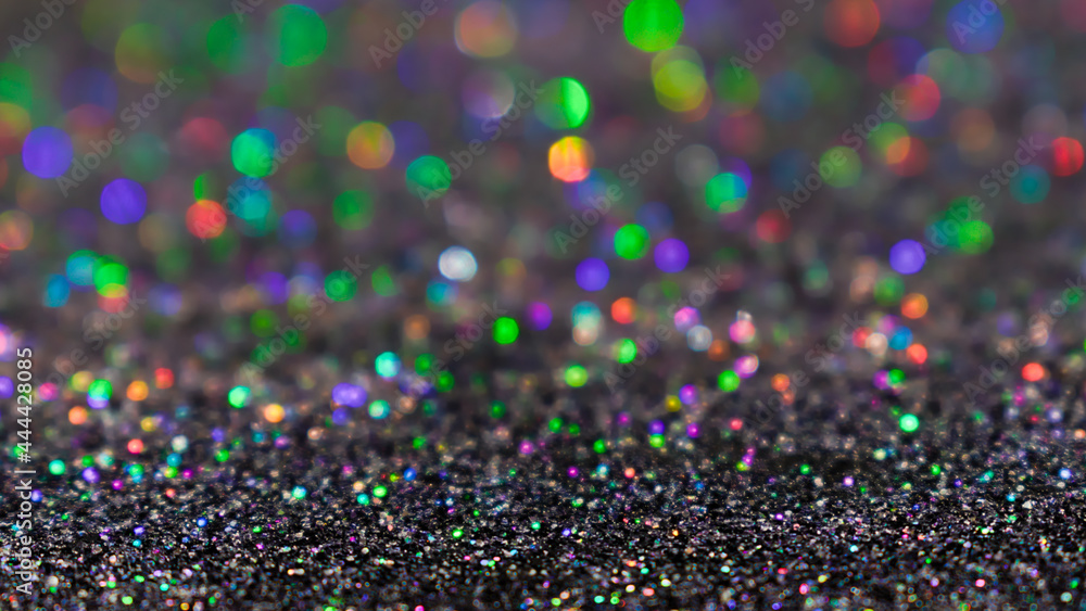 Colorful twinkle glitter background. Abstract festive background with bright lights