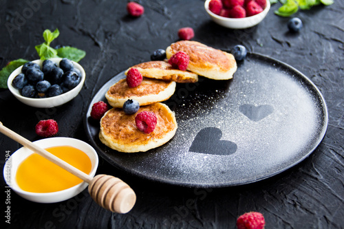 Wallpaper Mural A healthy breakfast of cheese pancakes, berries, and honey. Creative atmospheric decoration Torontodigital.ca