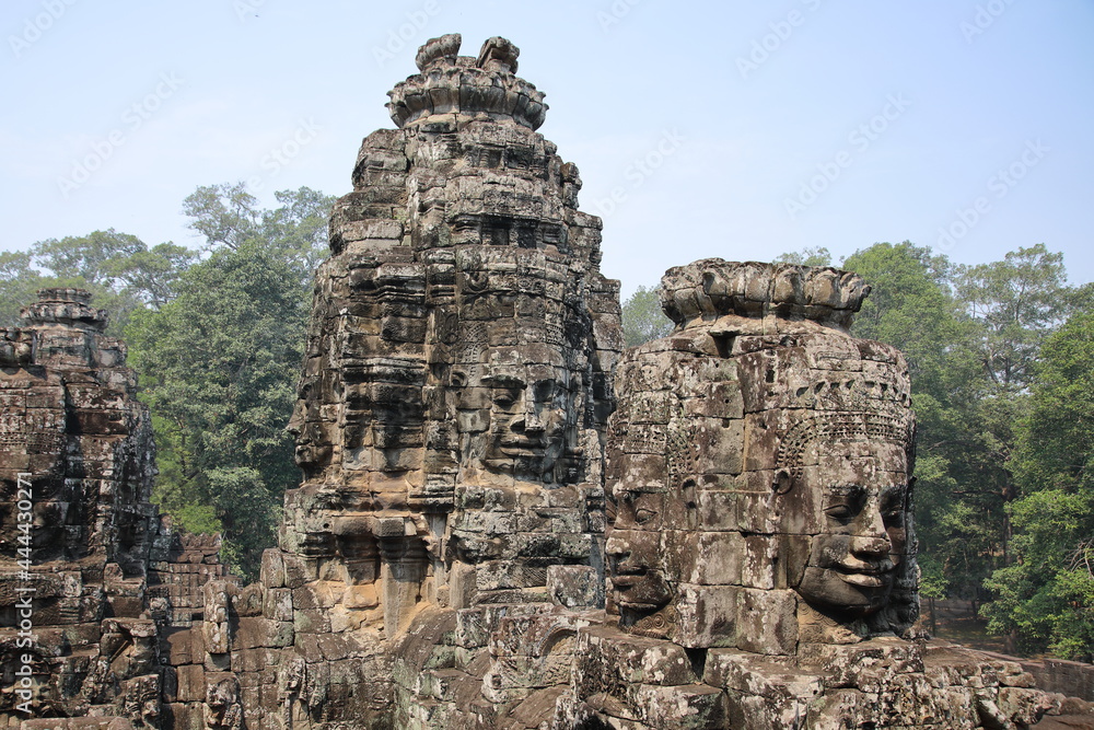 Smiling stone face on tower at Bayon, Cambodia