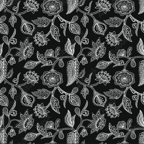 Vector seamless pattern with line drawn stylized leaves and flowers of exotic plants. Ethnic colorful doodle texture. Mehndi design.  Curved doodling background