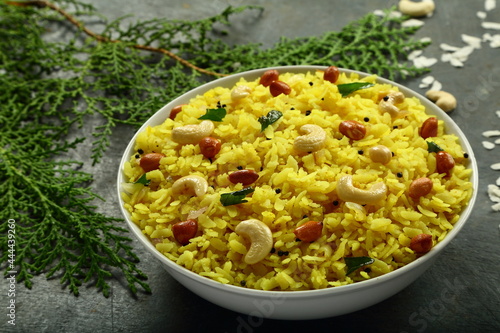 Healthy eating, Poha, traditional Indian cooking recipes, rice flakes dry cooked with spices. photo