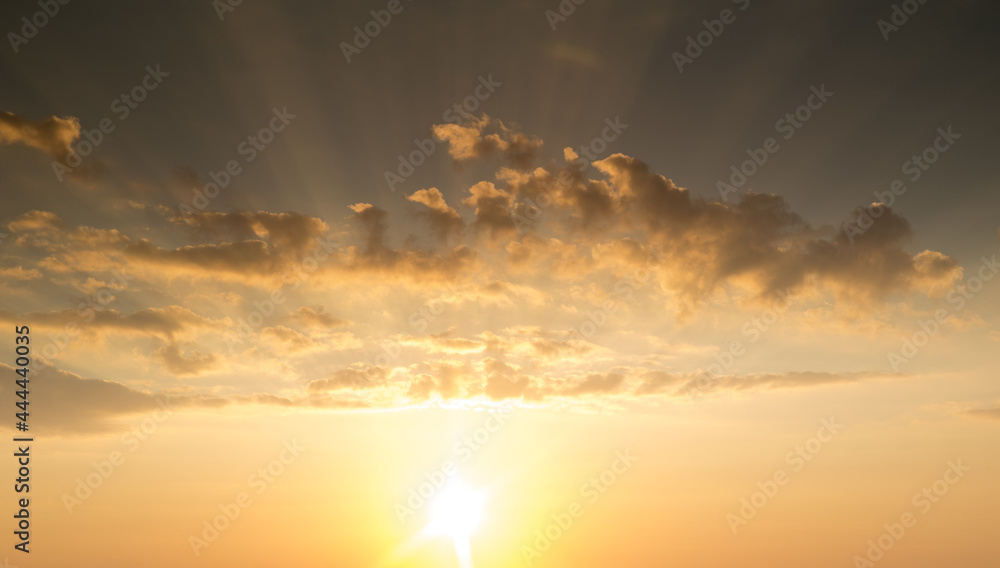 Sunset with sun rays, sky with clouds and sun Sunset with sun rays, sky with clouds and sun
