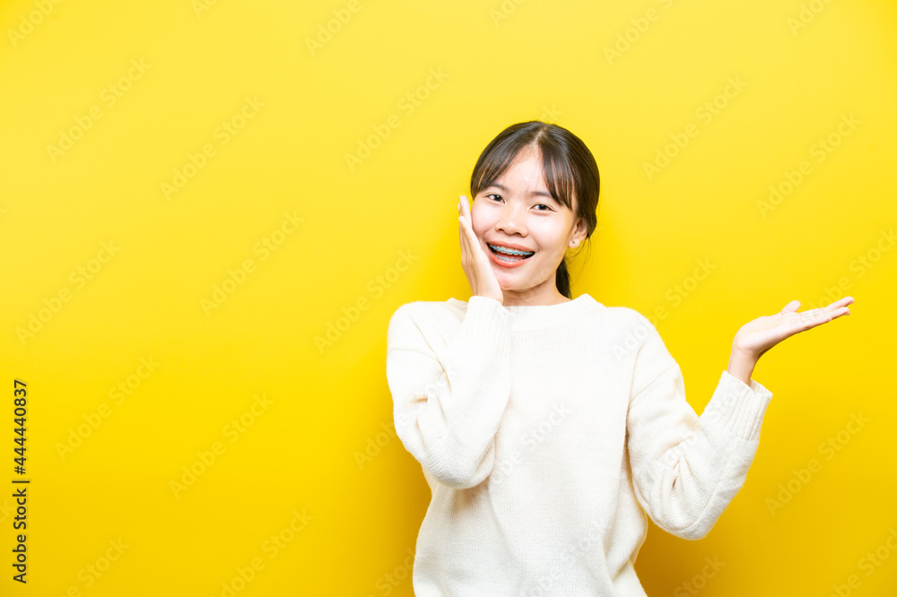 oung girl with headphones on yellow background oung girl with headphones on yellow background