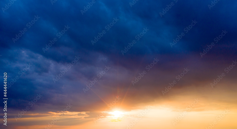 Sunset with sun rays, sky with clouds and sun Sunset with sun rays, sky with clouds and sun