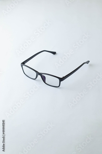 Black frame glasses isolated on white background. white board