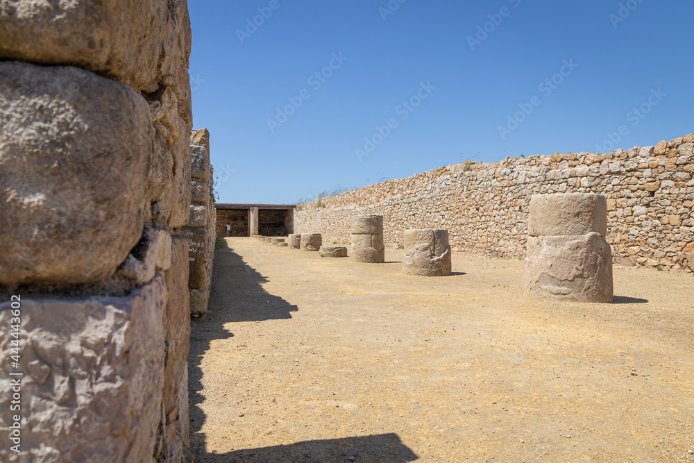 EMPURIES, SPAIN-MAY 8, 2021: Archaeological Remains of ancient city Empuries. Remains of a Greek rampart. Archaeology Museum of Catalonia, Spain.