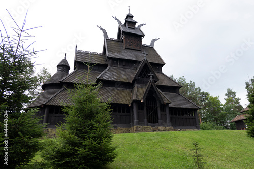 old wooden church with green grass