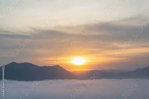 Beautiful sunrise with sea of fog in the early moring at phu thok chiang khan district leoi city thailand.Chiang Khan is an old town and a very popular destination for Thai tourists © Sumeth