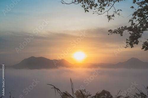 Beautiful sunrise with sea of fog in the early moring at phu thok chiang khan district leoi city thailand.Chiang Khan is an old town and a very popular destination for Thai tourists