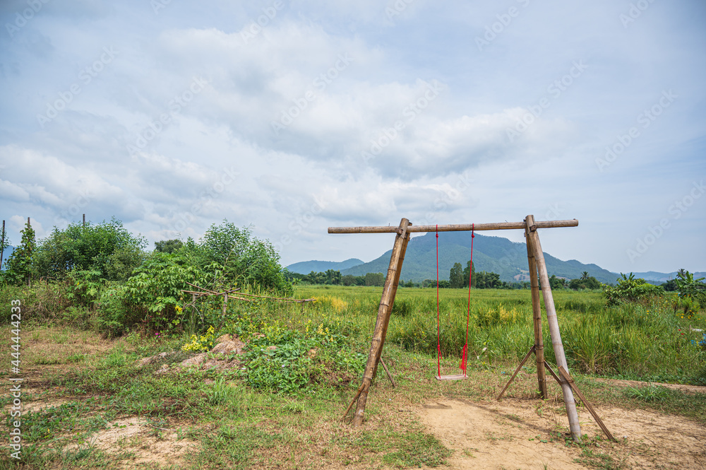 traddition Wooden swing with beautiful mountian at chiang khan district loei thailand.