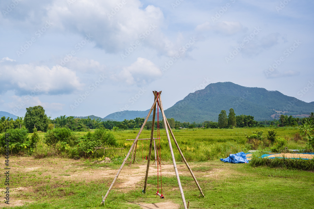 traddition Wooden swing with beautiful mountian at chiang khan district loei thailand. traddition Wooden swing with beautiful mountian at chiang khan district loei thailand.