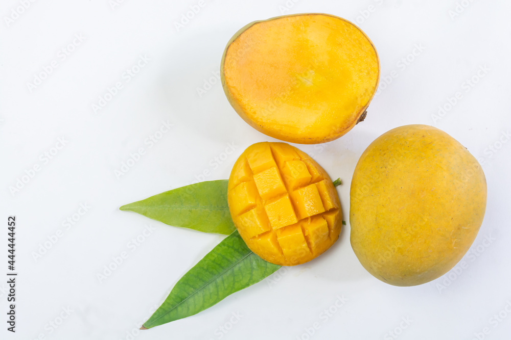 Fresh ripe mango tropical fruit with green leaf on white isolated background. Fresh ripe mango tropical fruit with green leaf on white isolated background.