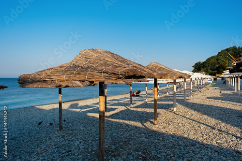 Beach umbrellas from straw in the resort village of Nebug  Krasnodar Territory  Russia..