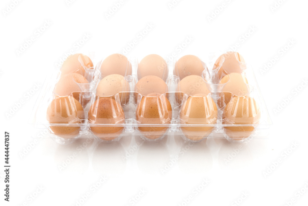 Eggs in plastic box isolated on white background Eggs in plastic box isolated on white background