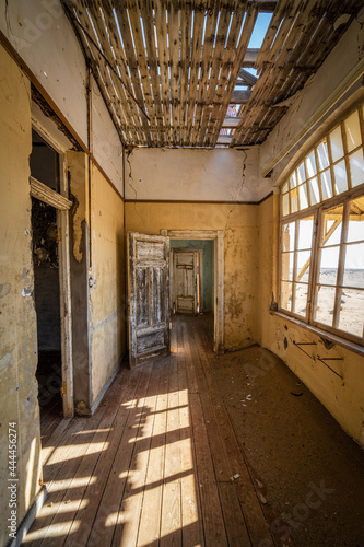 Abandoned building interiors in Kolmanskop, a ghost town in the Namib desert near Luderitz, Namibia, southwest Africa.