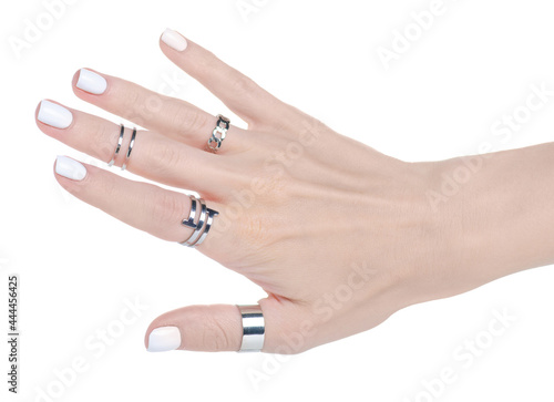 Female hand with silver rings on white background isolation