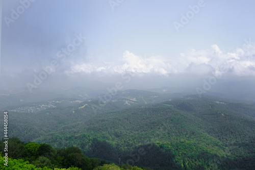 View of mountains and forest from above  mountain Akhun hills and forest in the morning fog