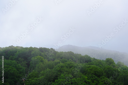 View of mountains and forest from above, mountain Akhun hills and forest in the morning fog © Наталия Чубакова