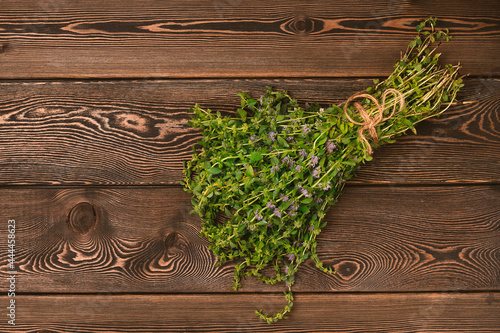 Bouquet, Fresh spice, Ombalo, blooming, marsh mint, Georgian cuisine, horizontal, no people, on a wooden table, top view, 