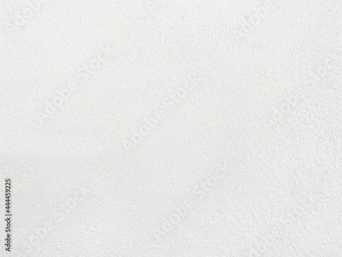Seamless texture of white cement wall a rough surface, with space for text, for a background. © Sittipol 