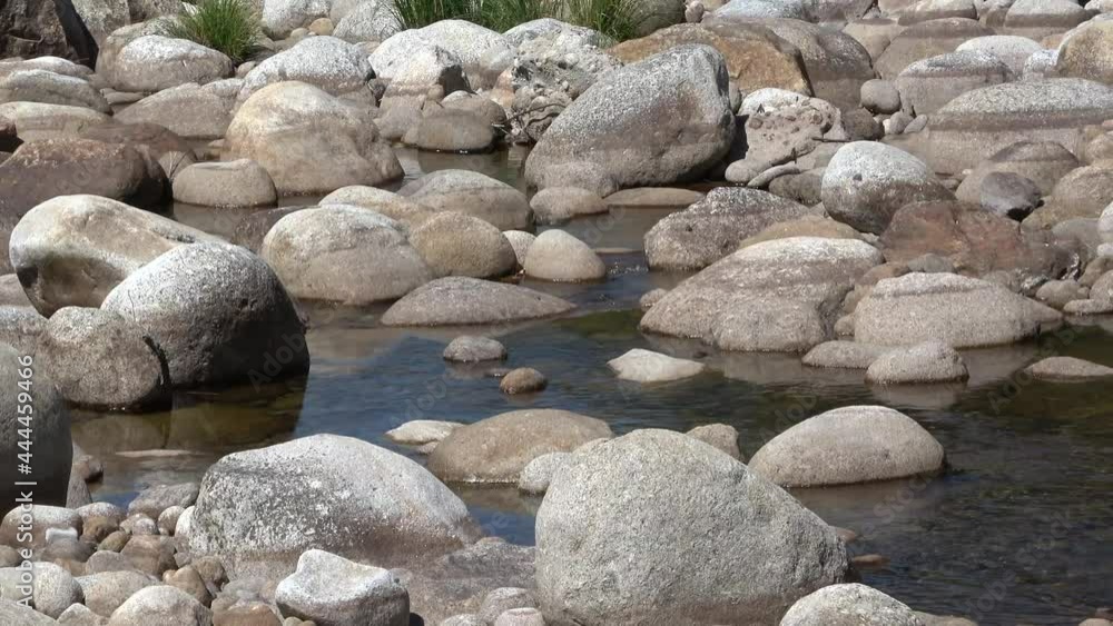 Water running down the stones of a river. Water running down the stones of a river.