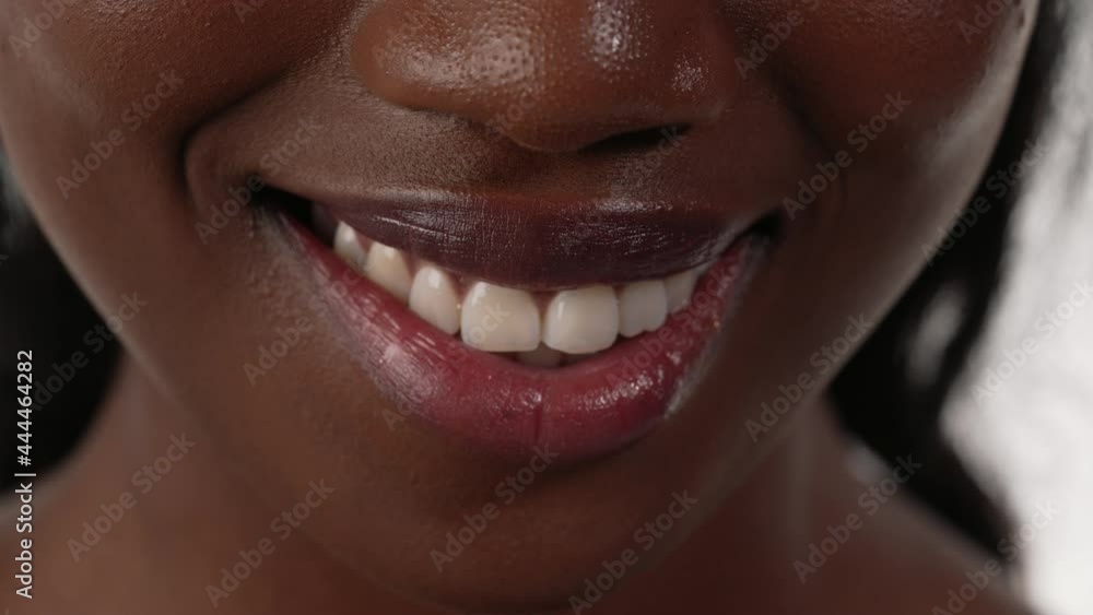 Close up of an african woman's mouth, biting her lips. Close up of an african woman's mouth, biting her lips.